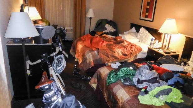 Hotel room with cycle gear strewn throughout.