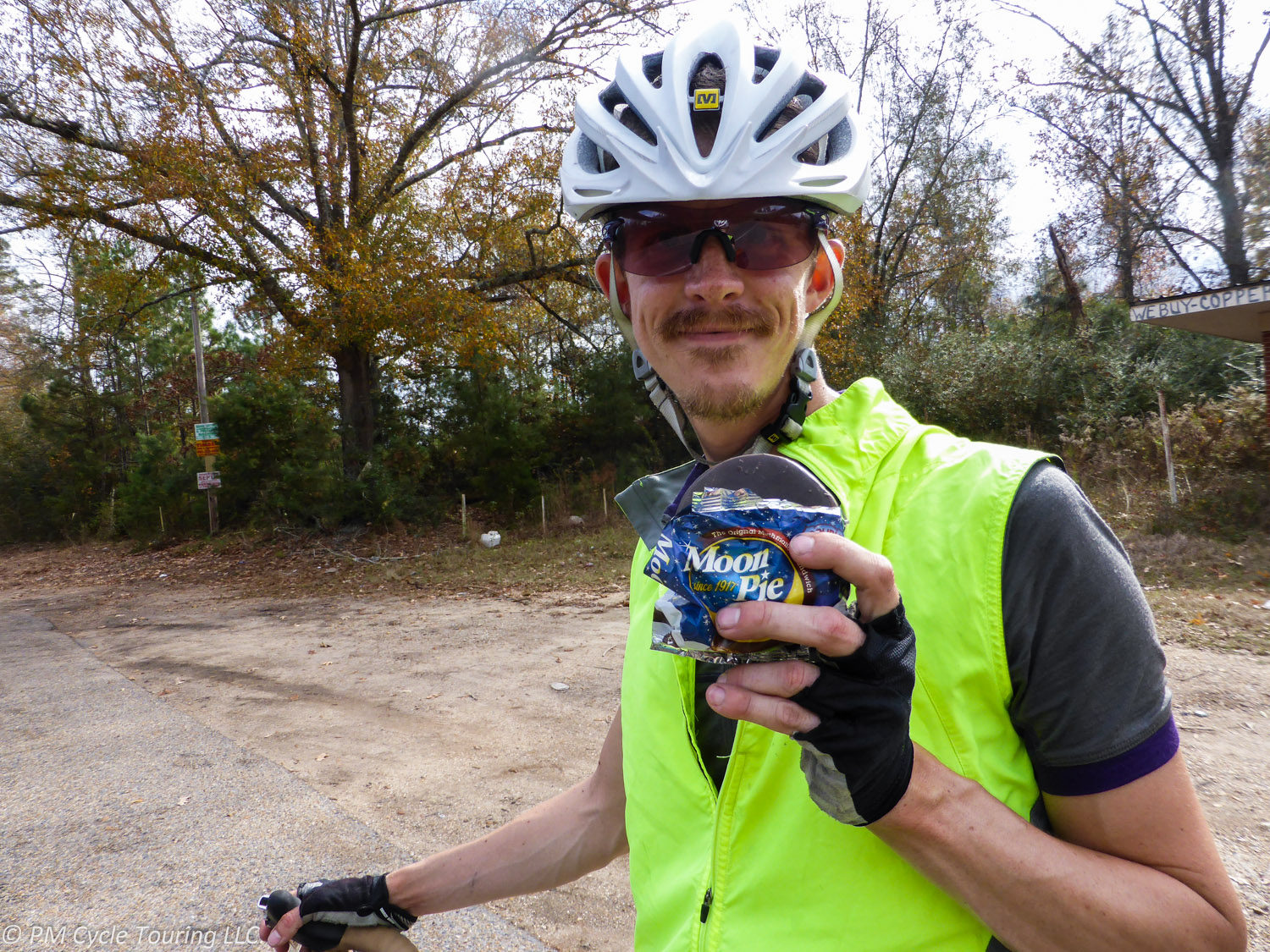 A bicyclist holds up a Moon Pie
