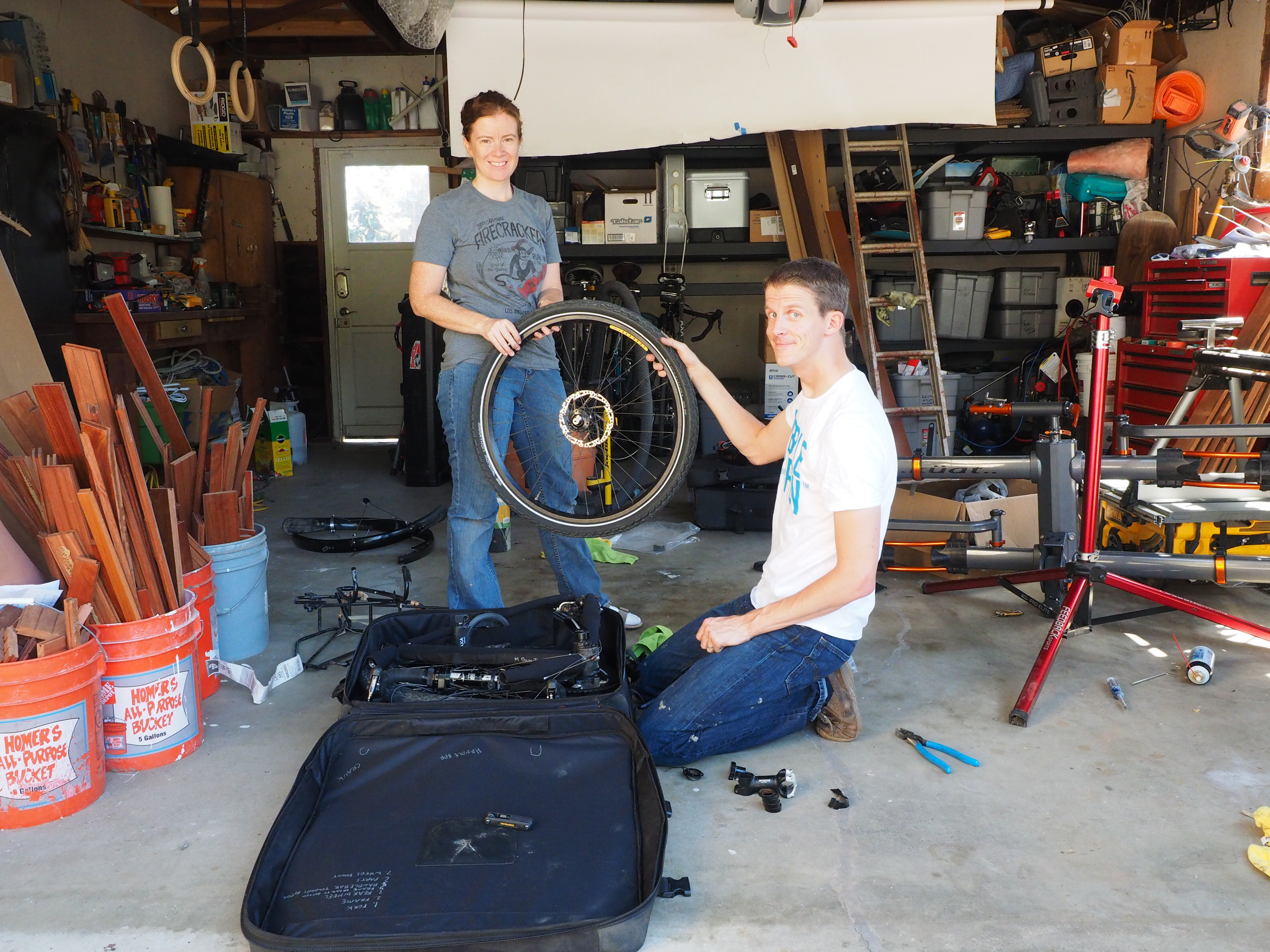 Pam and I holding the front tire as we pack Matt's bike